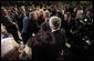 President George W. Bush reaches out to members of the audience Tuesday, April 2, 2008, after he delivered a keynote speech in Bucharest hours before the opening of the two-day NATO Summit. White House photo by Eric Draper