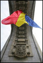 The flag of Romania hangs proudly from the Arcul de Triumf, a 27-meter high arch located in north Bucharest, site of the 2008 NATO Summit. White House photo by Chris Greenberg