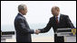 President George W. Bush and President Traian Basescu of Romania, shake hands after concluding their joint press availability Wednesday, April 2, 2008, at the presidential retreat in Neptun, Romania. White House photo by Eric Draper