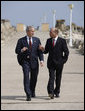 President George W. Bush and President Traian Basescu walk back from their joint press availability Wednesday on the grounds of the presidential retreat at Villas Neptun-Olimp in Neptun, Romania. White House photo by Eric Draper