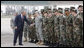 President George W. Bush reaches out to U.S. military personnel Wednesday, April 2, 2008, as he arrived at Mihail Kogalniceanu Airport in Constanta, Romania, for his return flight to Bucharest after meeting with President Traian Basescu at his presidential retreat in Neptun. White House photo by Eric Draper