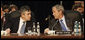 President George W. Bush and Prime Minister Gordon Brown of the United Kingdom, speak together at the start of the day’s session Thursday, April 3, 2008, at the 2008 NATO Summit in Bucharest. White House photo by Eric Draper