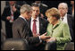 President George W. Bush joins Danish Prime Minister Anders Fogh Ransmussen and German Chancellor Angela Merkel Thursday, April 3, 2008, prior to the start of the afternoon's NATO Summit Meeting on Afghanistan in Bucharest. White House photo by Eric Draper