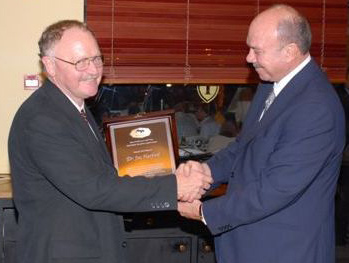   Dr. Joe Harford (l) receives the AMAAC award from former Prime Minister Al Fayez of Jordan. 