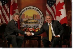 President George W. Bush and Canadian Prime Minister Stephen Harper shake hands in their first meeting to discuss issues Monday, April 21, 2008, during the 2008 North American Leaders' Summit in New Orleans. White House photo by Joyce N. Boghosian