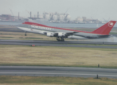 Photograph of an airplane taking off from the runway.