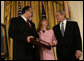 President George W. Bush smiles as he shares a moment with George and Sally Monsoor after presenting them the Congressional Medal of Honor in honor of their son, Petty Officer Michael A. Monsoor. The Navy SEAL was honored posthumously Tuesday, April 8, 2008, for his heroism while serving in Iraq. White House photo by David Bohrer