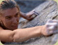 Woman climbing vertical rock face