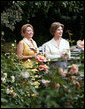 Mrs. Laura Bush talks with Mrs. Kateryna Yushchenko, wife of President Viktor Yushchenko of Ukraine, during a walk through the Rose Garden Monday, Sept. 29, 2008, at the White House. White House photo by Joyce N. Boghosian