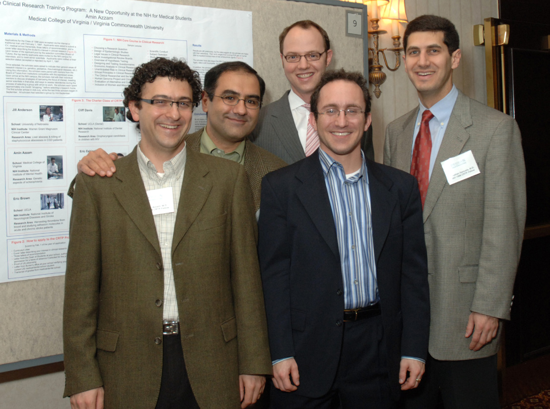 Members of the 1997-1998 founding class (from l) Drs. Amin Azzam, Eric Eskioglu, David Robbins, Uri Lopatin and Jonathan Samuels stand before their poster at a dinner for CRTP alumni sponsored by the Foundation for NIH and Pfizer Inc. 