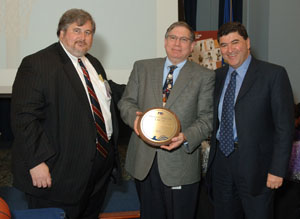 At the recent CFC “Center Court” presentations ceremony were (from l) Tony De Cristofaro, executive director of the CFC of the National Capital Area; NIDCR director Dr. Lawrence Tabak, holding the Million Dollar Circle Award; and NIH director Dr. Elias Zerhouni.