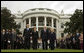 President George W. Bush and Mrs. Laura Bush and Vice President Dick Cheney and Mrs. Lynne Cheney stand at attention during the observance Thursday, Sept. 11, 2008, on the South Lawn of the White House of the seventh anniversary of the September 11 terrorist attacks. White House photo by Eric Draper