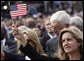 A woman waves an American flag during the dedication ceremony of the 9/11 Pentagon Memorial Thursday, Sept. 11, 2008, in Arlington, Va. White House photo by Eric Draper