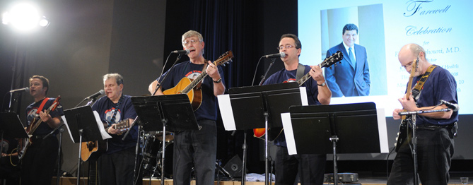 The Directors rock band features (from l) NHLBI’s Dr. John Tisdale on bass, NIAMS’s Katz on guitar and vocals, Collins on guitar/vocals, OD’s John Burklow on guitar/vocals, and NIAMS’s Dr. John O’Shea on guitar. Not visible are keyboard player Dr. Tracey Rouault of NICHD and Dr. Steven Libutti of NCI on drums.