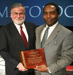 NIDDK director Dr. Griffin Rodgers (r) accepts award from ASH president Dr. Andrew Schafer.