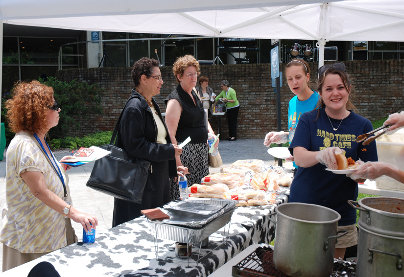 Staff from the Hard Times Café serve food to a crowd that gathered on a beautiful spring day. 