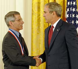 Dr. Anthony Fauci is honored by President Bush.