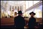 Leaders of the Jewish Community in St. Petersburg, Russia, stand inside the Grand Choral Synagogue while President Bush and Laura Bush tour restoration of the synagogue, the only Jewish house of worship in a city of 4.5 million people.   White House photo by Paul Morse