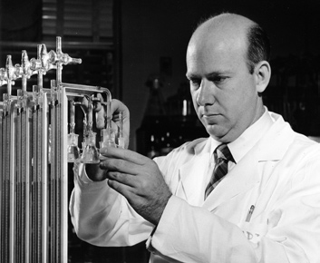 Stadtman was one of the first recruits to the intramural program of the National Heart Institute when it began in 1950. Here he adjusts a Warburg apparatus.