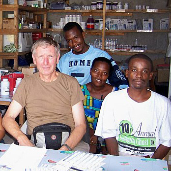 CC pharmacist Dr. Frank Nice (l) prepares to fill prescriptions in a pharmacy in Haiti with Haitian pharmacists, technicians and nurses.