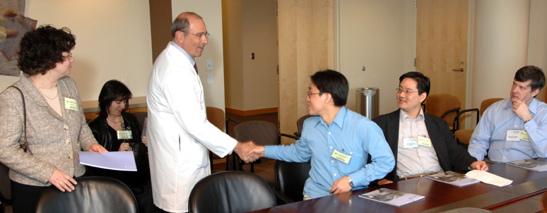 Clinical Center director Dr. John Gallin welcomes CTSA scholars (from l) Dr. Natalia Morone from the University of Pittsburgh; Tsvetelina Parvanova from the Mayo Clinic; Dr. George Tseng from the University of Pittsburgh; Dr. Andrew Chang from Montefiore Medical Center; and Dr. Thomas Clark Gamblin from the University of Pittsburgh.