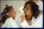 photo of female doctor examining female patient