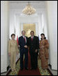 President George W. Bush and Mrs. Laura Bush are greeted by President Susilo Bambang Yudhoyono of Indoniesia and Herawati Yudhoyono at the Presidential Palace in Bogor, Indonesia, after arriving in the country for a six-hour visit Monday, Nov. 20, 2006. White House photo by Eric Draper