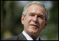 President George W. Bush smiles during a press availability Friday, Nov. 17, 2006, with Australian Prime Minister John Howard at the Sheraton Hanoi Hotel. White House photo by Paul Morse