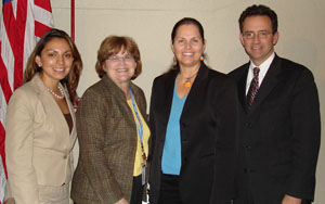 Dr. Cynthia Lindquist (second from r) is joined by (from l) Nicole Schuett, seminar coordinator; Dr. Janet Austin, director of the NIAMS Office of Communica-tions and Public Liaison; and John Burklow, NIH associate director for communications and public liaison. 