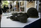 A recovered helmet, canteen and shoe are among articles on display Saturday, Nov. 18, 2006, as President George W. Bush visits the Joint POW/MIA Accounting Command in Hanoi. White House photo by Eric Draper