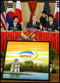 President George W. Bush pauses during a trilateral meeting Saturday, Nov. 18, 2006, with Shinzo Abe, right, Prime Minister of Japan, and President Roh Moo-Hyun, of the Republic of Korea. White House photo by Eric Draper