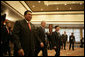 President George W. Bush is flanked by Indonesian President Susilo Bambang Yudhoyono, left, and Viet President Nguyen Minh Triet as they arrive Saturday, Nov. 18, 2006, for a meeting with Southeast Asian leaders at the International Convention Center in Hanoi. White House photo by Eric Draper