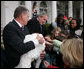 President George W. Bush invites children to meet “Flyer” the turkey, held by Lynn Nutt of Springfield, Mo., during a ceremony Wednesday, Nov. 22, 2006 in the White House Rose Garden, following the President’s pardoning of the turkey before the Thanksgiving holiday. White House photo by Paul Morse