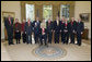 President George W. Bush and Mrs. Laura Bush stand with the 2006 National Humanities Medal recipients in the Oval Office Thursday, Nov., 9, 2006. Pictured from left, they are: Mark Noll, historian of religion; Mary Lefkowitz, classicist; Meryle Secrest, biographer; Bernard Lewis, Middle Eastern scholar; John Raisian senior fellow and director of the Hoover Institution; Robert Fagles, translator and classicist; Nickolas Davatzes, historian; Kevin Starr, historian; Fouad Ajami, Middle Eastern studies scholar; James Buchanan, economist; and NEH chairman Bruce Cole. White House photo by Paul Morse