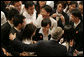 President George W. Bush greets students after delivering remarks Thursday, Nov. 16, 2006, at the National University of Singapore. White House photo by Paul Morse