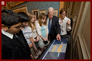 Librarian of Congress James Billington shows one of the new interactive displays in the "Creating the United States" exhibition to local middle school students during a special preview of the Library of Congress Experience. 2008