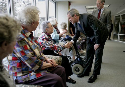 President George W. Bush and Senator Charles, Grassley, R-Iowa, greet residents at Wesley Acres Senior Center in Des Moines, Iowa, Tuesday, April 11, 2006. The President visited Iowa to talk about the Medicare prescription drug benefits. "Every senior is saving money, and that's what people have got to know," said the President. "There is an easy way to find out how the program works, and that's to call 1-800-Medicare, or you can go on the computer systems at Medicare.gov." White House photo by Eric Draper