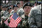 Soldiers listen as Vice President Dick Cheney delivers remarks at a rally at Fort Riley Army Base in Kansas, Tuesday, April 18, 2006. During his address the vice president recognized the 3rd Brigade Combat Team of the 24th Infantry Division by welcoming them home from their recent tour in Iraq and thanking them for their service and support during the Iraqi elections. White House photo by David Bohrer