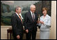 Victor Mooney, American Egg Board Chairman and Louis Raffel, American Egg Board President, present Mrs. Laura Bush with an annual commemorative egg from the American Egg Board Thursday, April 6, 2006 at the White House. The egg shell has been carved to display the Presidential Seal. White House photo by Shealah Craighead