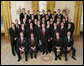 President George W. Bush stands with members of the Auburn University Men’s Swimming and Diving Team Thursday, April 6, 2006, during a photo opportunity with the 2005 and 2006 NCAA Sports Champions at the White House. White House photo by Paul Morse