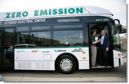 President George W. Bush listens to AC Transit Employee Jamie Levin while standing in the doorway of a bus powered by fuel cell technology during a tour of the California Fuel Cell Partnership in West Sacramento, California, Saturday, April 22, 2006.  White House photo by Eric Draper