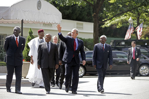 President George W. Bush walks with the Presidents from Botswana, Ghana, Namibia, Mozambique and Niger along West Executive Avenue at the White House Monday, June 13, 2005. President Bush and the African leaders met in the Oval Office before delivering a statement about AGOA to the press in the Dwight D. Eisenhower Executive Office Building. White House photo by Eric Draper