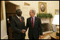 Meeting with the leaders from Mozambique, Botswana, Niger, Ghana and Namibia, President George W. Bush welcomes President John Kufuor of Ghana to the Oval Office Monday, June 13, 2005. The leaders discussed a range of topics, including AGOA. "All the Presidents gathered here represent countries that have held democratic elections in the last year," said President Bush. "What a strong statement that these leaders have made about democracy and the importance of democracy on the continent of Africa." White House photo by Eric Draper