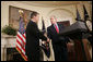 President George W. Bush shakes the hand of Christopher Cox (R-Calif.) after introducing him Thursday, June 2, 2005, as his nominee for Chairman of the Securities and Exchange Commission. White House photo by Paul Morse