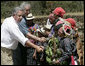 President George W. Bush and President Oscar Berger of Guatemala meet members of the Patzun Dance Group after a performance Monday, March 12, 2007, during a visit to Iximche, Guatemala. White House photo by Eric Draper