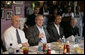 President George W. Bush is joined by New Orleans Mayor Ray Nagin, Louisiana Lt. Gov. Mitch Landrieu, left, and New Orleans Archbishop Alfred Hughes, right, Thursday, March 1, 2007 in New Orleans, during a luncheon with elected officials and community leaders on the recovery progress of their Gulf Coast region. White House photo by Eric Draper