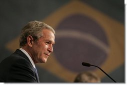 President George W. Bush smiles as he listens to Brazil President Luiz Inacio Lula da Silva reply to a question Friday, March 9, 2007, during a joint press availability in Sao Paulo. Said President Lula, "The memorandum of understanding on biofuels, which our ministers signed today, is a decisive step. Bringing together their efforts, the U.S. and Brazil can further push the democratization of energy and bring biofuels to all." White House photo by Paul Morse