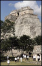 President George W. Bush and President Felipe Calderon of Mexico participate in a tour Tuesday, March 13, 2007, of the Uxmal ruins. Behind them is the Pyramid of the Magician, a 117-feet high structure, which legend holds was built in a single night by a dwarf boy. White House photo by Paul Morse