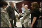 President George W. Bush talks with U.S. Army Pfc. Joshua Ryan Nielsen of Manvanola, Colo., and his family Friday, March 30, 2007, during a visit to Walter Reed Army Medical Center in Washington, D.C. White House photo by Eric Draper