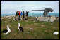 Mrs. Laura Bush views albatross birds and remnants of World War II with wildlife biologist John Klavitter during a tour of Eastern Island on Midway Atoll, part of the Northwest Hawaiian Islands National Monument, Thursday March 1, 2007. Midway Atoll was the site of the Battle of Midway June 4, 1942. The U.S. Navy defeated a Japanese attack against Midway Islands, marking a turning point in the war in the pacific theater. White House photo by Shealah Craighead